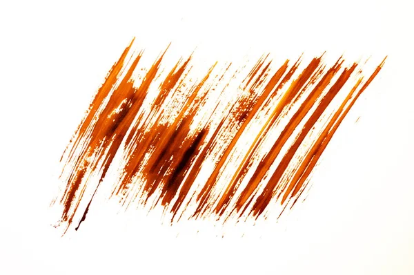 Manchas de tinta marrom em um fundo branco . — Fotografia de Stock