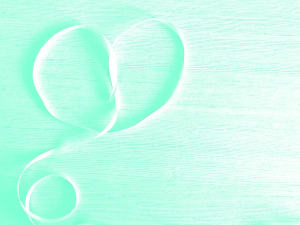 Heart made of white ribbon on a wooden background. Aqua Menthe. — Stock Photo, Image