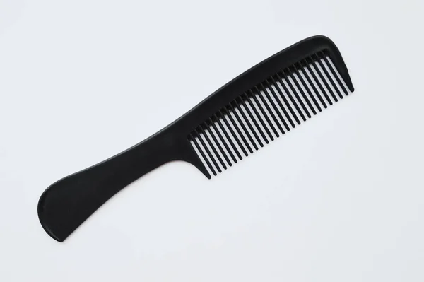 Black Plastic Comb Lies White Background Isolate — Stock Photo, Image