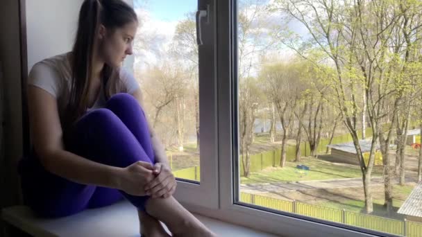 Young Beautiful Girl Dark Hair Ponytails Her Head Sits Windowsill — Stock Video