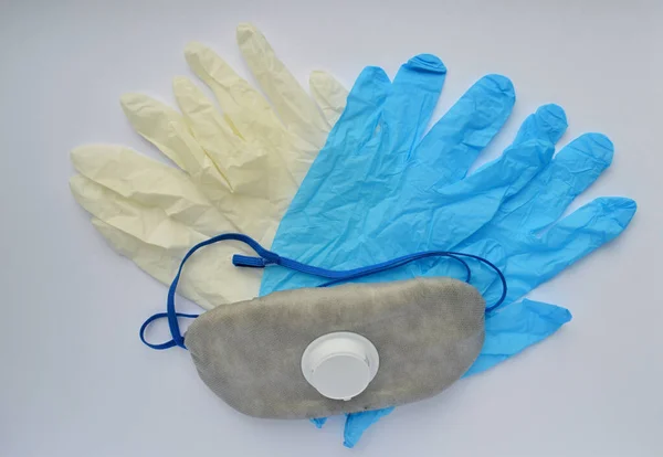 medical mask and rubber gloves on a white background. medical worker day. chemist day. World Trauma Day
