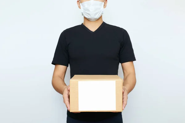 Man Mask Virus Respirator Holds Box Copy Space White Background — Stock Photo, Image