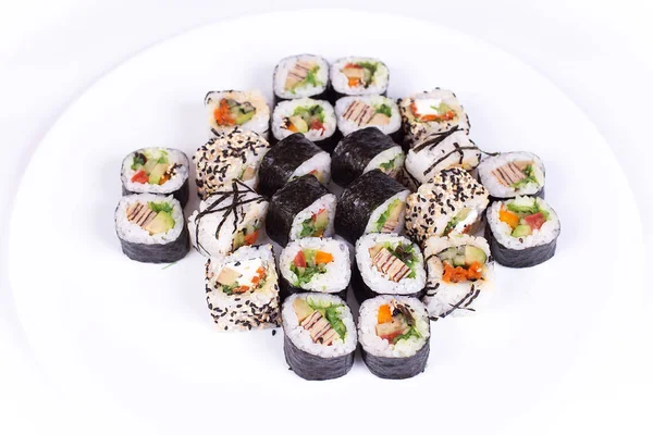 Japanese food restaurant, sushi maki gunkan roll plate or platter set. California  rolls with salmon.  isolated at white background. Top view, flat lay.