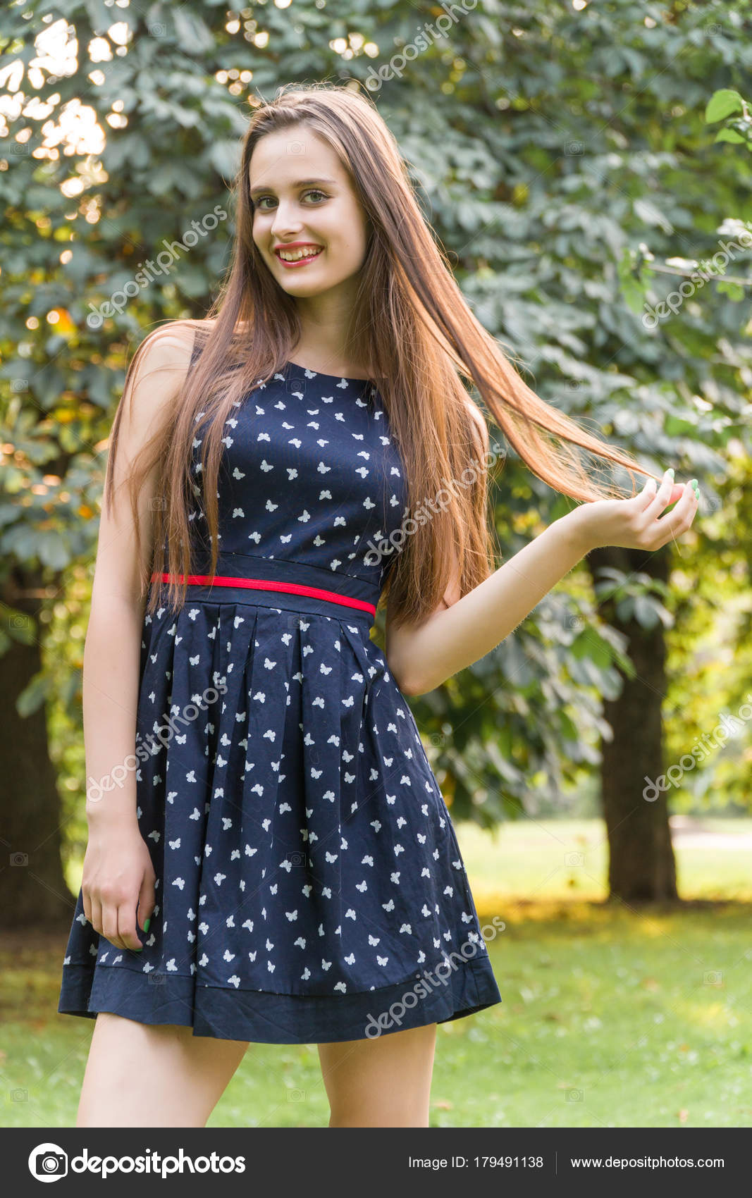 Young Beautiful Attractive Woman In A Stylish Dress Posing On Camera She Laughs Poses For The Camera Her Hair Blowing In The Wind Looking Very Happy Stock Photo Image By C Young Beautiful Attractive Woman In A Stylish Dress Posing On Camera She Laughs Poses For The Camera Her Hair Blowing In The Wind Looking Very Happy Stock Photo Image By C