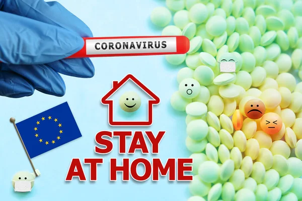 Quarantine and isolation - Stay at home. European Union Flag solidarity. Covid-19 coronavirus test for viral infection in a hand in a blue glove. Treatment 2019-nCoV.