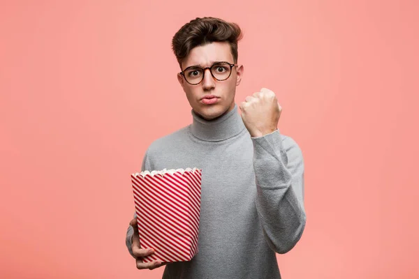 Young Intellectual Man Holding Popcorn Bucket Showing Number One Finger — Stock Photo, Image