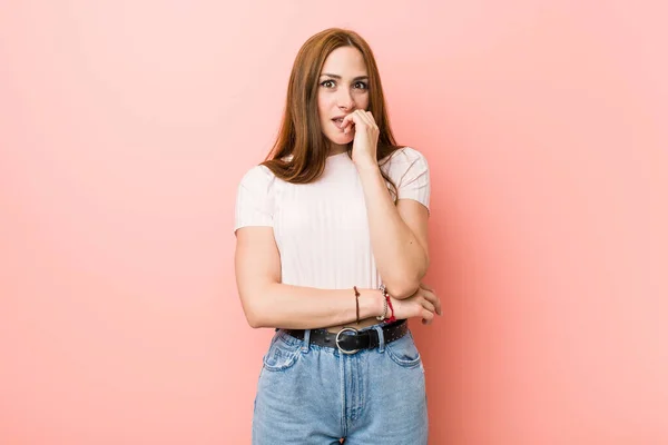 Young Redhead Ginger Woman Pink Wall Biting Fingernails Nervous Very — Stock Photo, Image