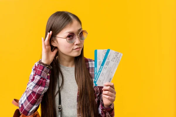 Young Asian Woman Holding Air Tickets Trying Listening Gossip — ストック写真