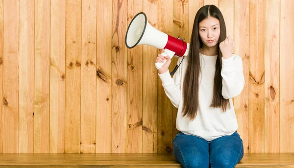 Young Asian Woman Holding Megaphone Showing Fist Camera Aggressive Facial — Zdjęcie stockowe