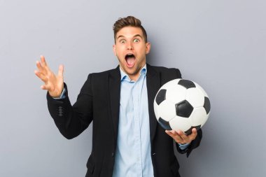 Young soccer trainer celebrating a victory or success