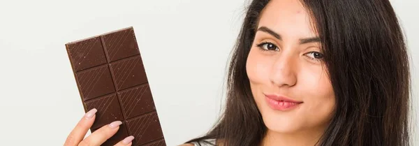Young Hispanic Woman Holding Chocolate Tablet — Stock Photo, Image