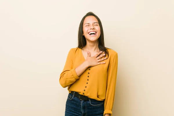 Young Hispanic Woman Beige Background Laughs Out Loudly Keeping Hand — ストック写真