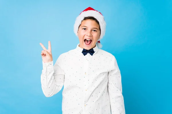 Elegant kid wearing a santa hat on a christmas day — Stock Photo, Image