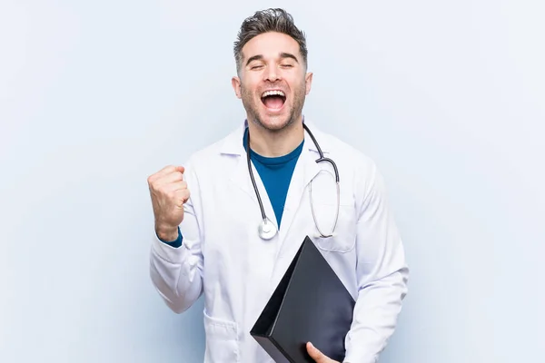 Caucasian Doctor Man Holding Folder Cheering Carefree Excited Victory Concept — Stock Photo, Image