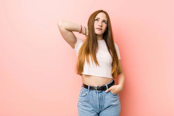 Young Redhead Ginger Woman Pink Wall Touching Back Head Thinking — Stock Photo, Image