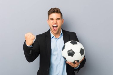 Young soccer trainer cheering carefree and excited. Victory concept.