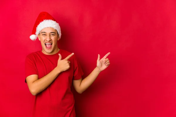 Young Man Christmas Day Pointing Forefingers Copy Space Expressing Excitement — Stock Photo, Image