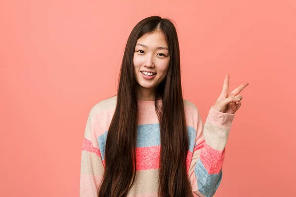 Young Cool Chinese Woman Joyful Carefree Showing Peace Symbol Fingers — Stock Photo, Image