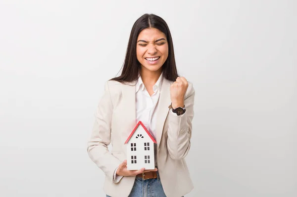 Young Arab Woman Holding House Icon Cheering Carefree Excited Victory — Stock Photo, Image