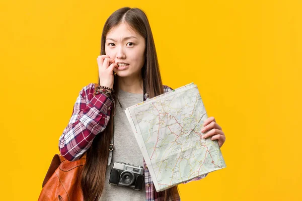 Young Asian Woman Holding Map Biting Fingernails Nervous Very Anxious — Stock Photo, Image