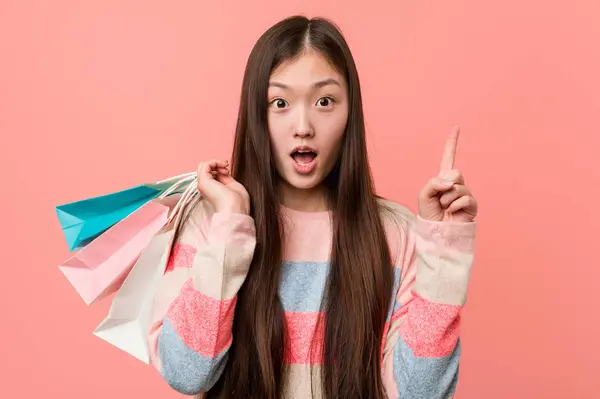 Young Asian Woman Holding Shopping Bag Having Some Great Idea — 图库照片