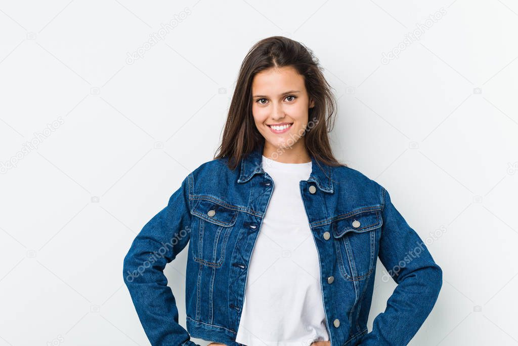 Young cute woman confident keeping hands on hips.