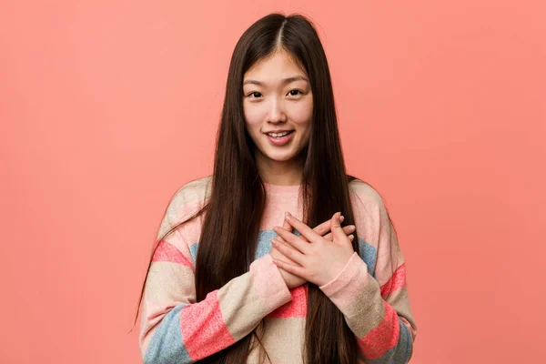 Young Cool Chinese Woman Has Friendly Expression Pressing Palm Chest — Stock Photo, Image