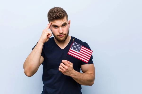 Young Caucasian Man Holding United States Flag Pointing His Temple — Stock Photo, Image