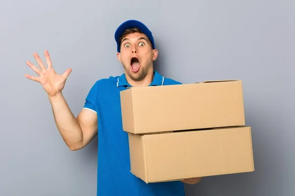 Young Man Delivering Packages Celebrating Victory Success — Stock Photo, Image