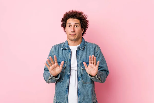 Curly Mature Man Wearing Denim Jacket Pink Background Rejecting Someone — Stock Photo, Image