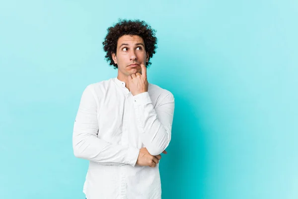 Young Curly Mature Man Wearing Elegant Shirt Relaxed Thinking Something — ストック写真