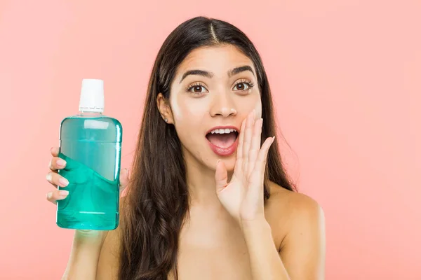 Young Indian Woman Holding Mouthwash Bottle Shouting Excited Front — Stock Photo, Image