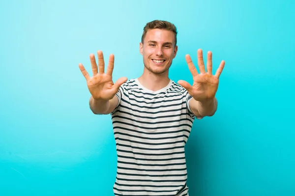 Young Caucasian Man Blue Wall Showing Number Ten Hands — ストック写真