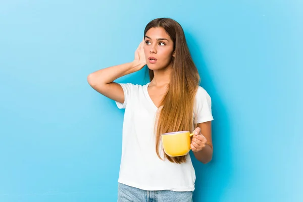 Young Caucasian Woman Holding Coffee Mug Trying Listening Gossip — 图库照片