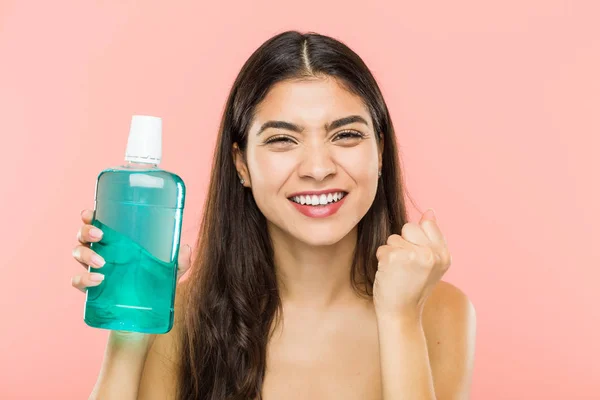 Young Indian Woman Holding Mouthwash Bottle Cheering Carefree Excited Victory — Stock Photo, Image