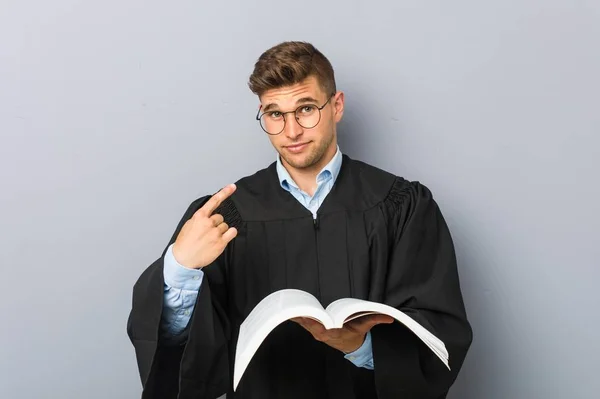 Young Jurist Holding Book Pointing Finger You Inviting Come Closer — Stock Photo, Image