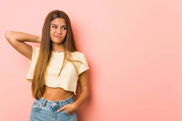 Young Slim Woman Touching Back Head Thinking Making Choice — Stockfoto