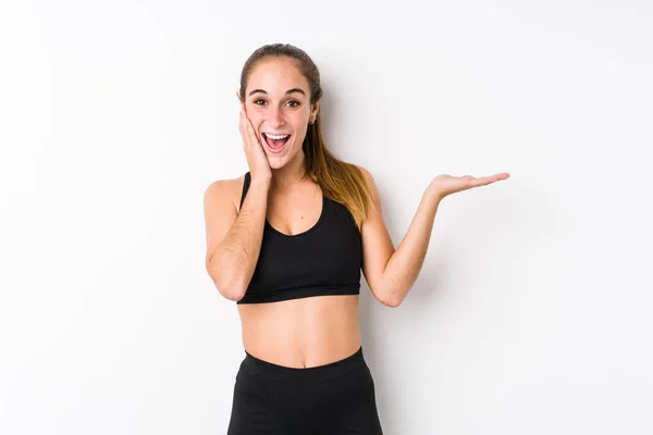 Young Caucasian Fitness Woman Posing White Background Holds Copy Space — 스톡 사진