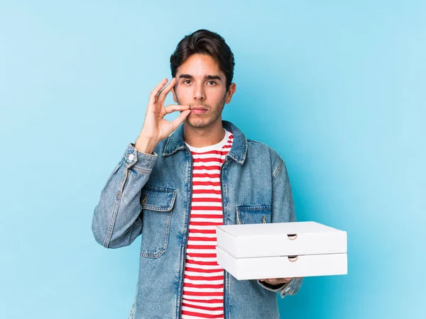 Young Caucasian Man Holding Pizzas Isolated Fingers Lips Keeping Secret — 스톡 사진