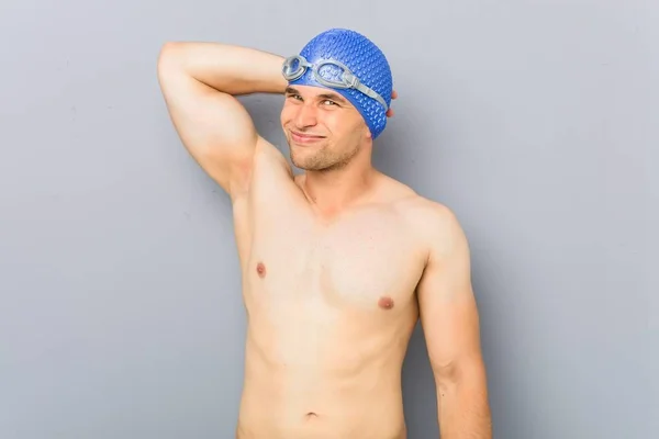 Young Professional Swimmer Man Touching Back Head Thinking Making Choice — 스톡 사진