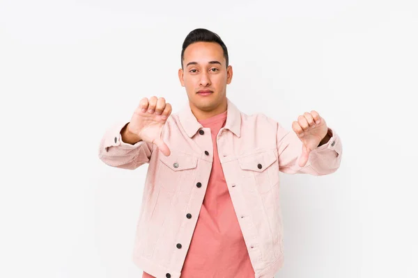 Young Latin Man Posing Isolated Showing Thumb Expressing Dislike — Stock Photo, Image