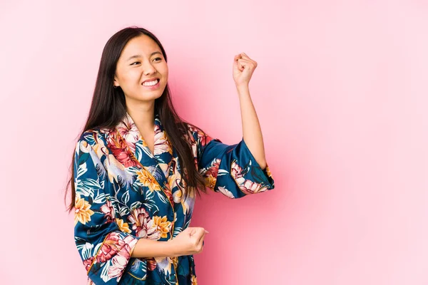 Young Chinese Woman Wearing Kimono Pajama Isolated Raising Fist Victory — 스톡 사진