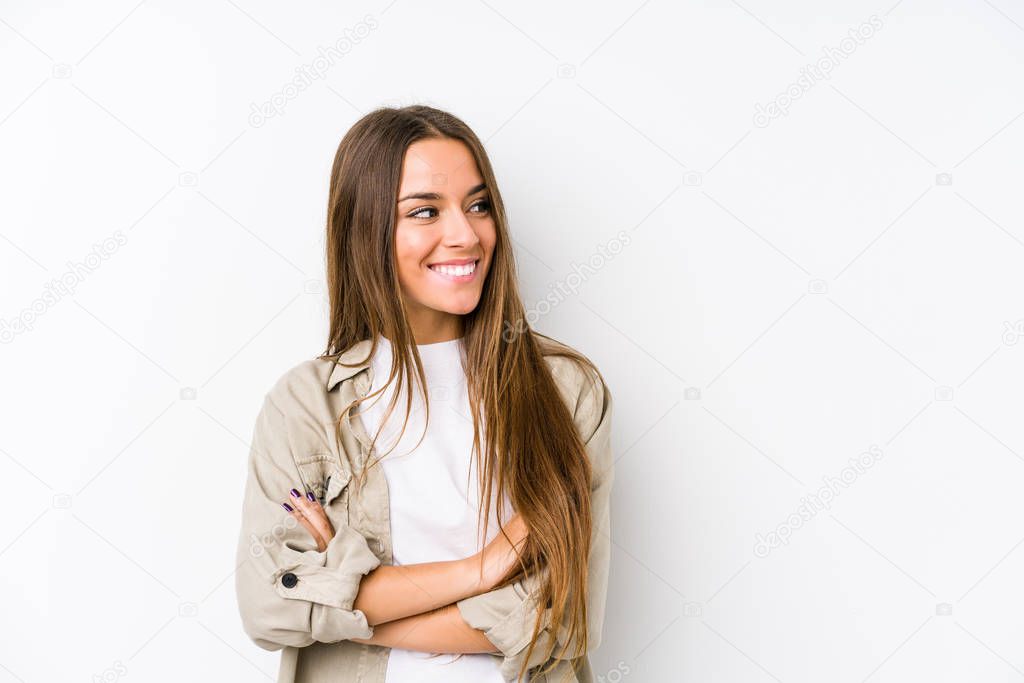 Young caucasian woman  isolated smiling confident with crossed arms.