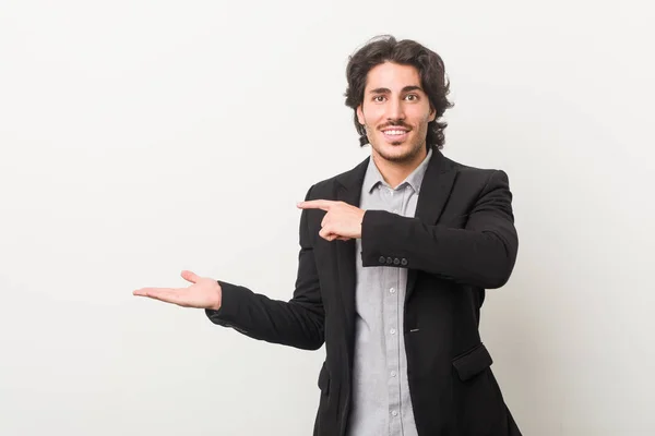 Young Business Man White Background Excited Holding Copy Space Palm — Stock Photo, Image