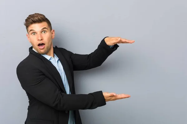 Young Handsome Caucasian Man Shocked Amazed Holding Copy Space Hands — Stock Photo, Image