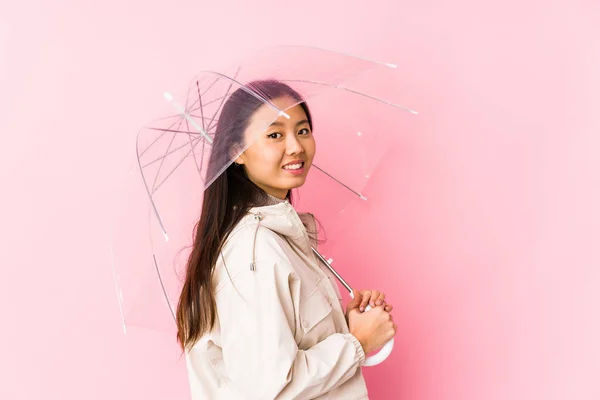 Young Chinese Woman Holding Umbrella Isolated Looks Aside Smiling Cheerful — 스톡 사진