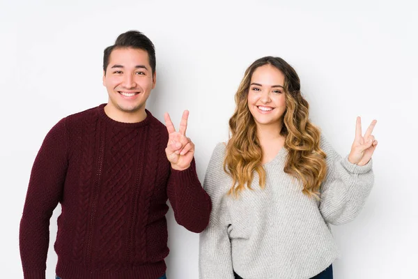 Young Couple Posing White Background Showing Victory Sign Smiling Broadly — 스톡 사진