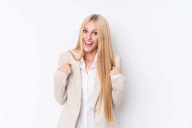 Young business blonde woman on white background surprised pointing with finger, smiling broadly. clipart