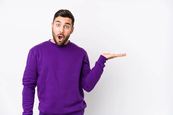 Young Caucasian Man White Background Isolated Impressed Holding Copy Space — Stock Photo, Image