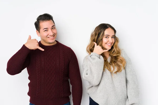 Young Couple Posing White Background Showing Mobile Phone Call Gesture — 스톡 사진